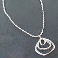 Silver Ball Necklace With Triple Ring Pendant In Silver Plate